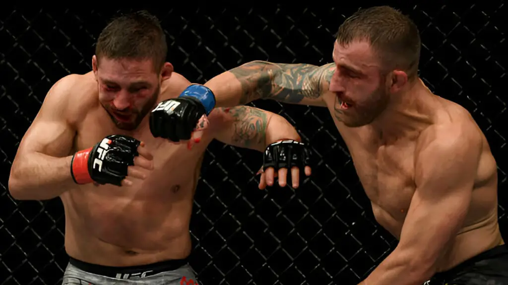 UFC star Alexander Volkanovski punches Chad Mendes during their fight at UFC 232