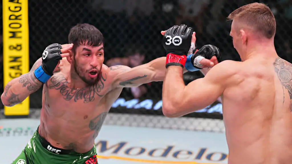 Former UFC fighter Genaro Valdez punches Evan Elder in their lightweight fight during the UFC Fight Night