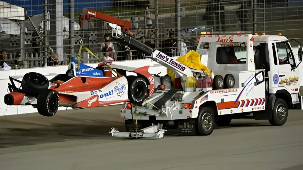 The car of Justin Wilson gets towed after a crash during the IZOD IndyCar Series MAVTV 500 World Championship