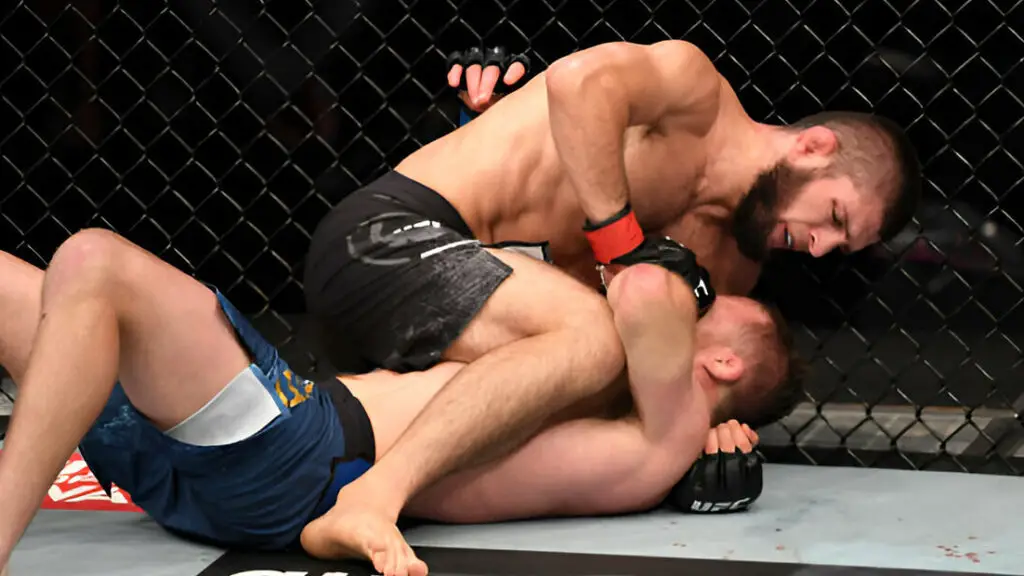 UFC star Khabib Nurmagomedov attempts to submit Justin Gaethje in their lightweight title bout during the UFC 254 event