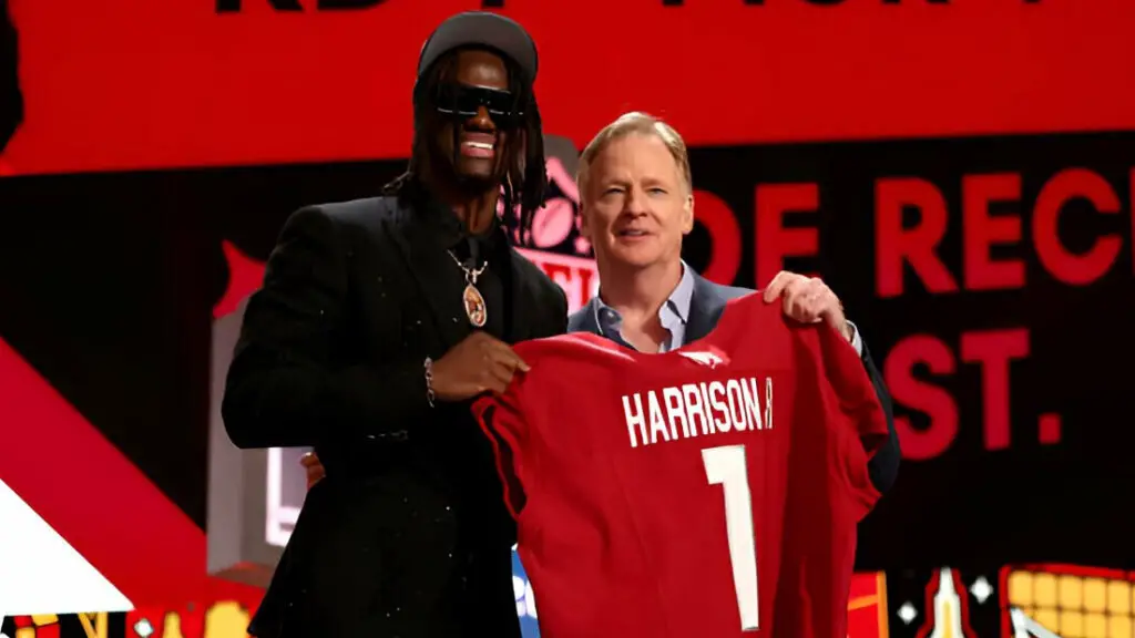 Former Ohio State Buckeyes wide receiver Marvin Harrison Jr. poses with NFL Commissioner Roger Goodell after being selected fourth overall by the Arizona Cardinals during the first round of the 2024 NFL Draft