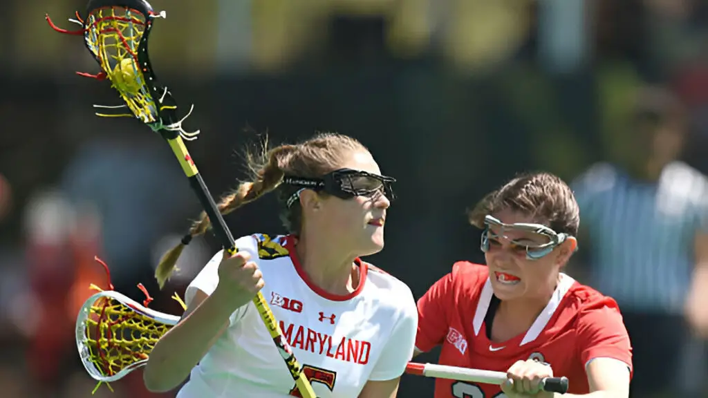 Maryland Terrapins player Jen Giles is pressured by Ohio State Buckeyes player Shannon Rosati during a college women's lacrosse game