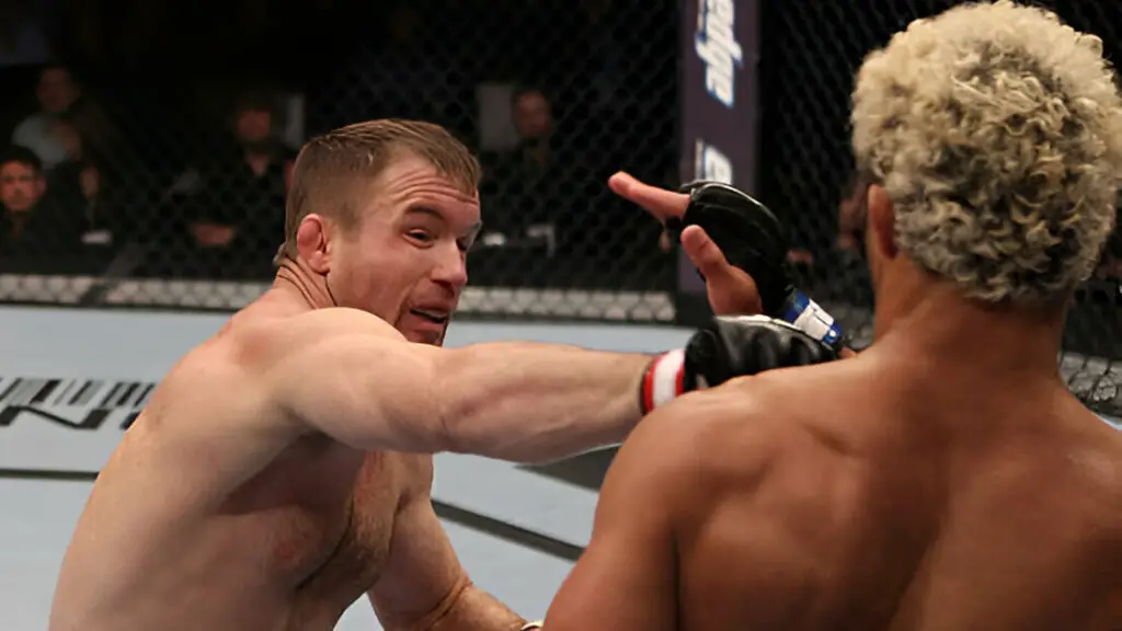 UFC fighter Matt Hughes punches Josh Koscheck during the UFC 135 event