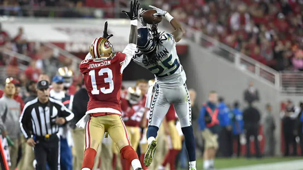 Seattle Seahawks cornerback Richard Sherman makes an interception in the fourth quarter on a ball intended for San Francisco 49ers wide receiver Steve Johnson