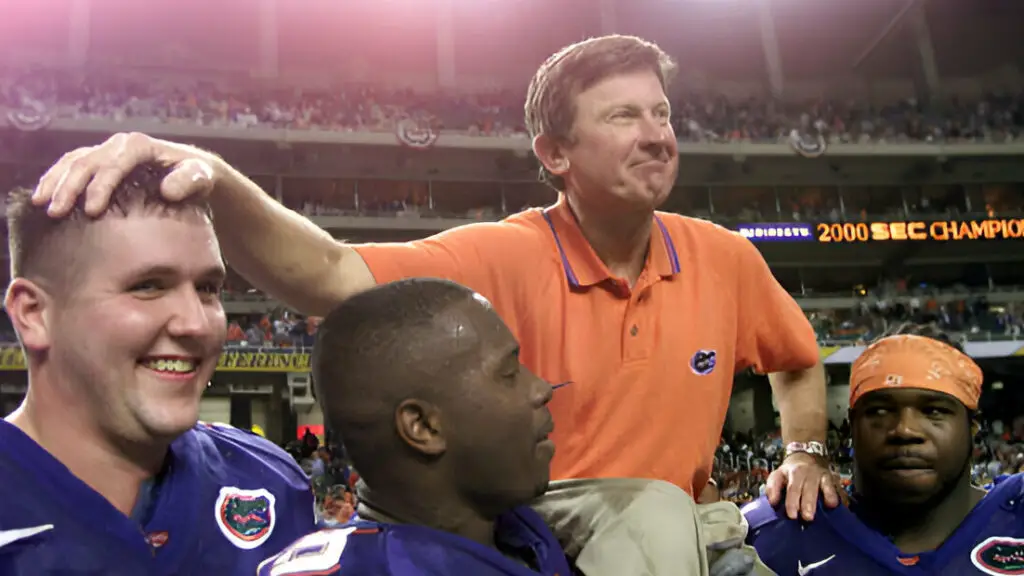 Florida Gators head coach Steve Spurrier is carried off the field by players following the Gators' 28-6 victory over Auburn to win the Southeastern Conference (SEC) Championship 