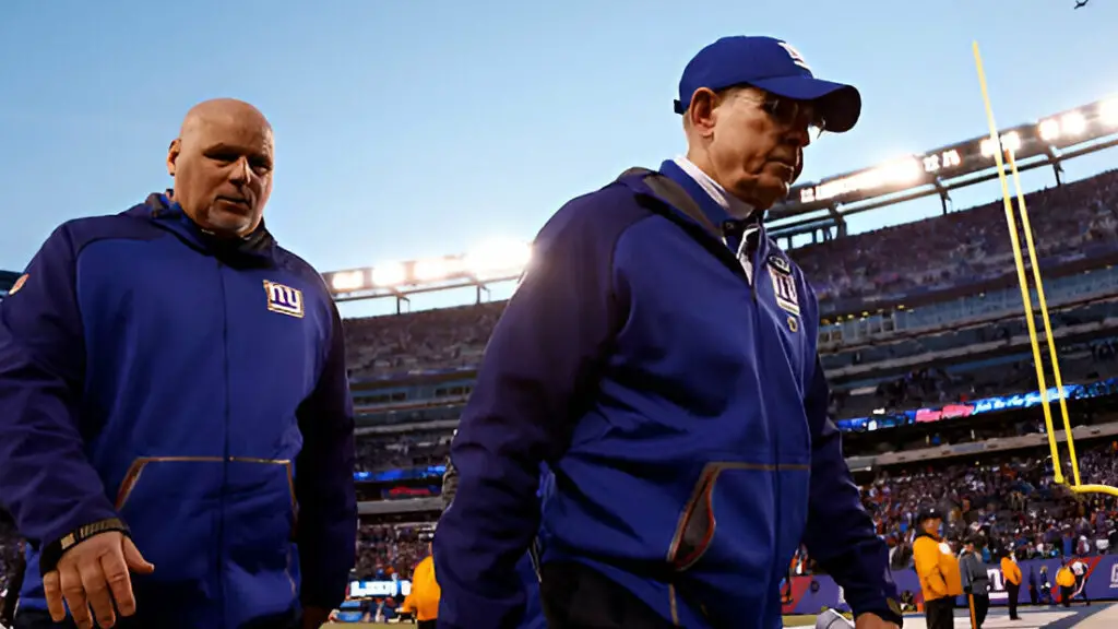 New York Giants head coach Tom Coughlin walks off the field after being defeated by the Carolina Panthers in their game