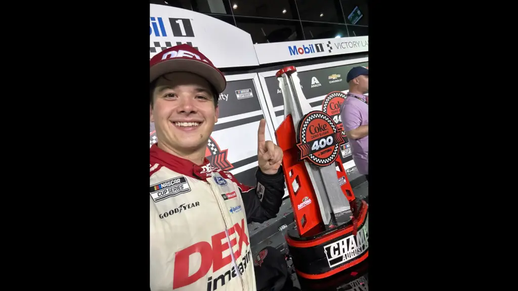 NASCAR Cup Series driver Harrison Burton celebrates in victory lane after winning the Coke Zero Sugar 400