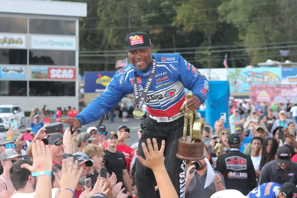 Matco Tools Top Fuel Dragster driver Antron Brown celebrates with the fans at his home track at Maple Grove Raceway