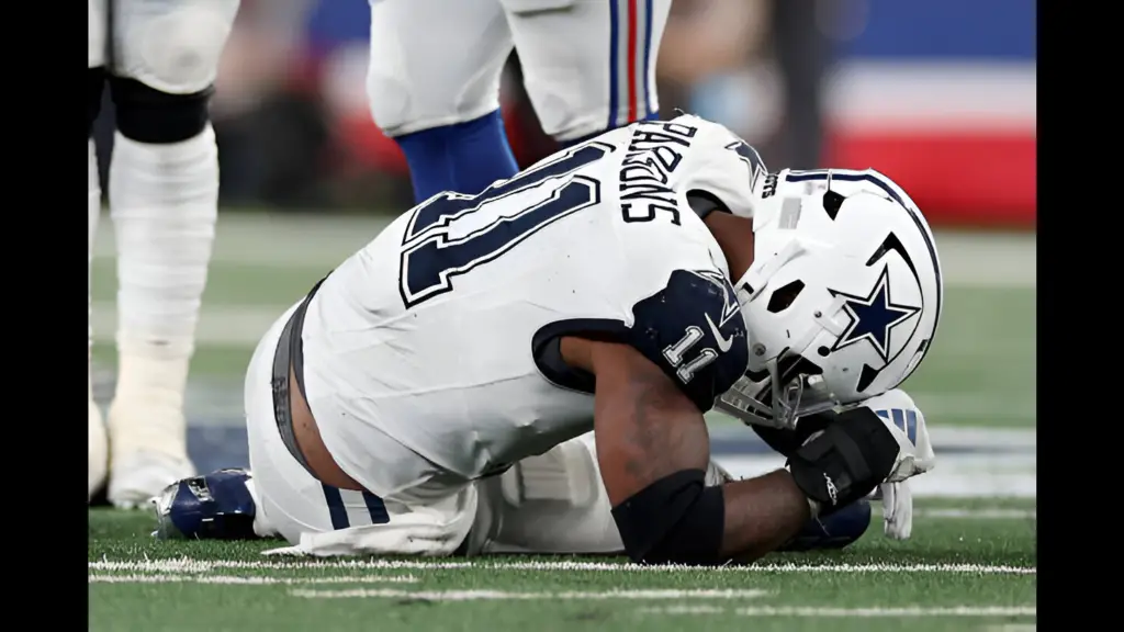 Dallas Cowboys star pass rusher Micah Parsons reacts on the ground after a play in the fourth quarter against the New York Giants