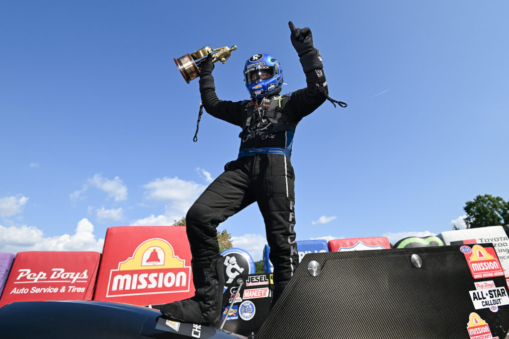 Funny Car driver Austin Prock celebrates after winning the Pep Boys NHRA Nationals at Maple Grove Raceway