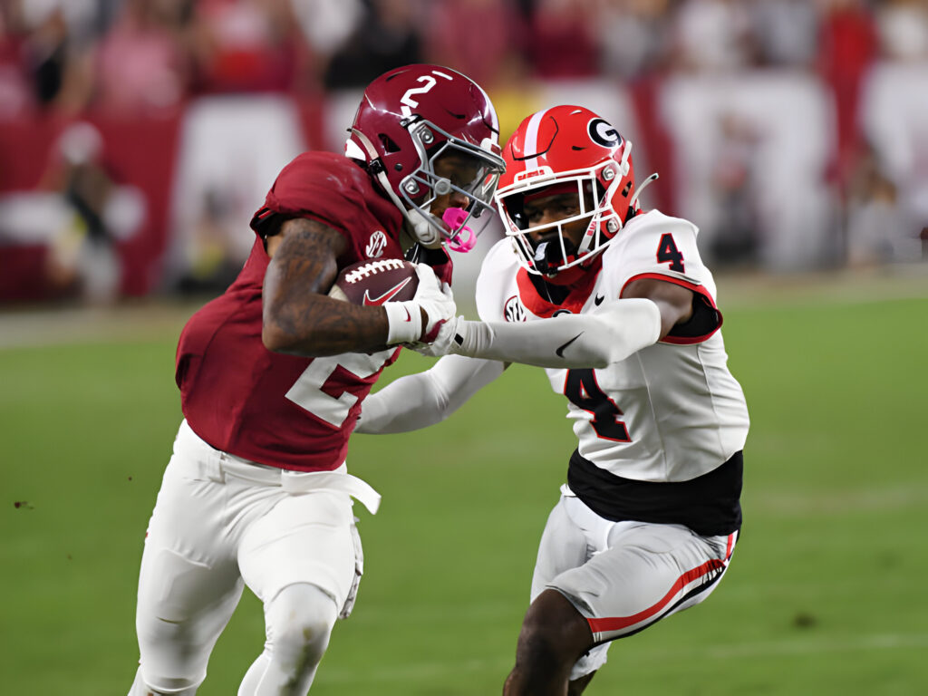 Alabama Crimson Tide wide receiver Ryan Williams rushes the ball as Georgia Bulldogs defensive back KJ Bolden defends him during the college football game between the Georgia Bulldogs and the Alabama Crimson Tide