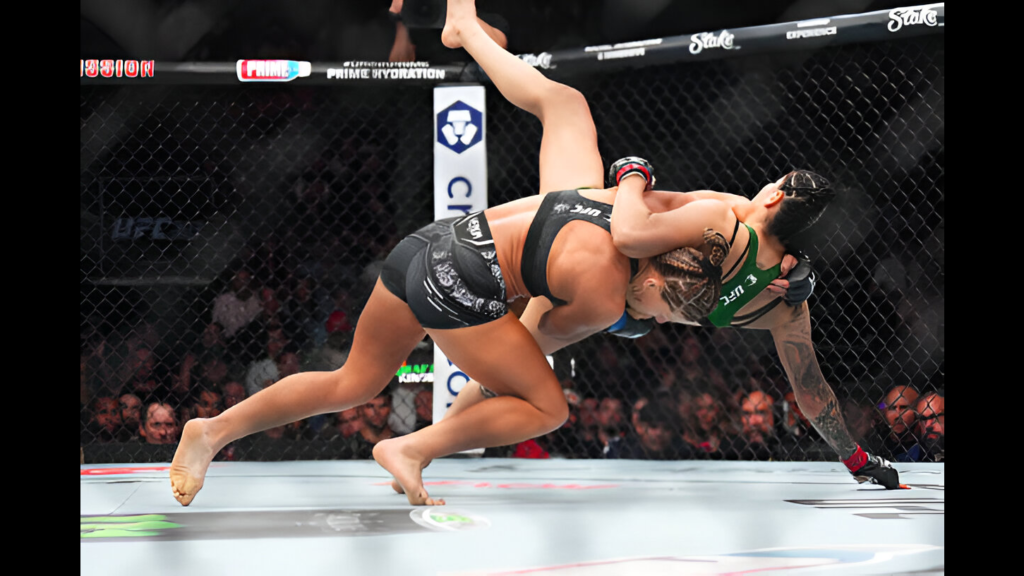 UFC fighter Kayla Harrison takes down Ketlen Vieira of Brazil in a bantamweight fight during the UFC 307 event