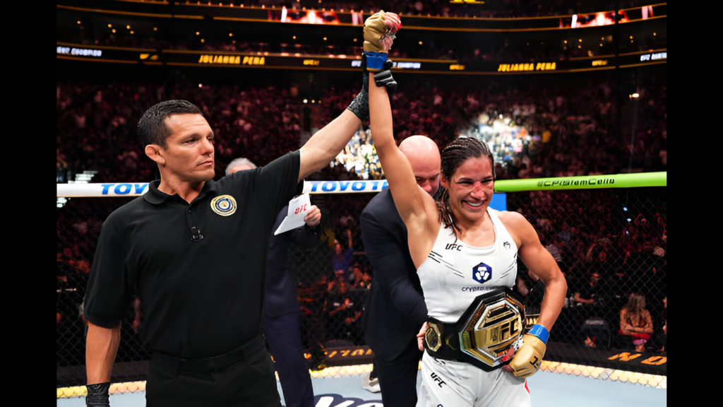 UFC fighter Julianna Peña reacts after her victory against Raquel Pennington in the UFC bantamweight championship fight during the UFC 307 event