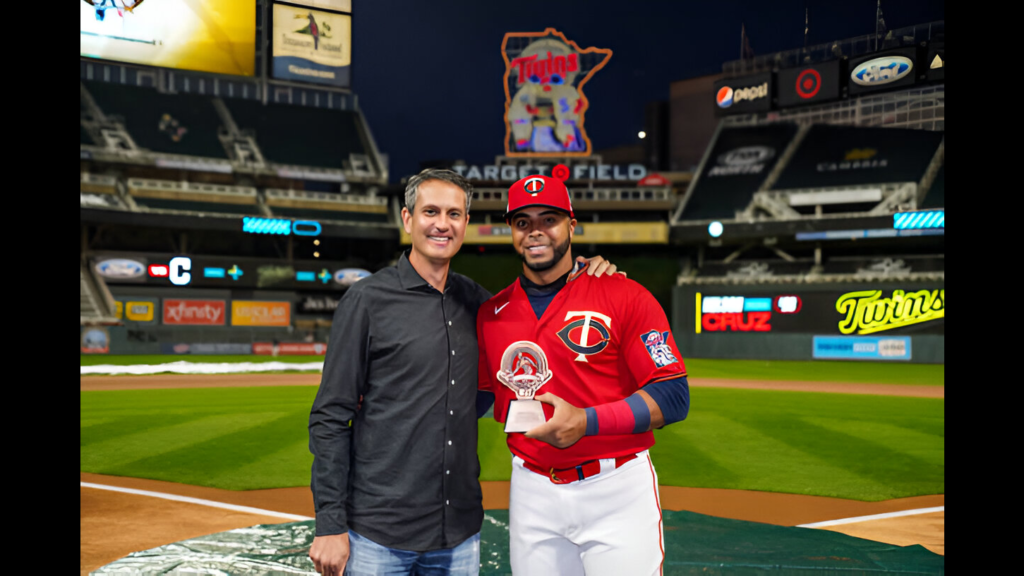 Former Minnesota Twins General manager Thad Levine presents the Roberto Clemente Award to Nelson Cruz prior to the game against the Cleveland Indians