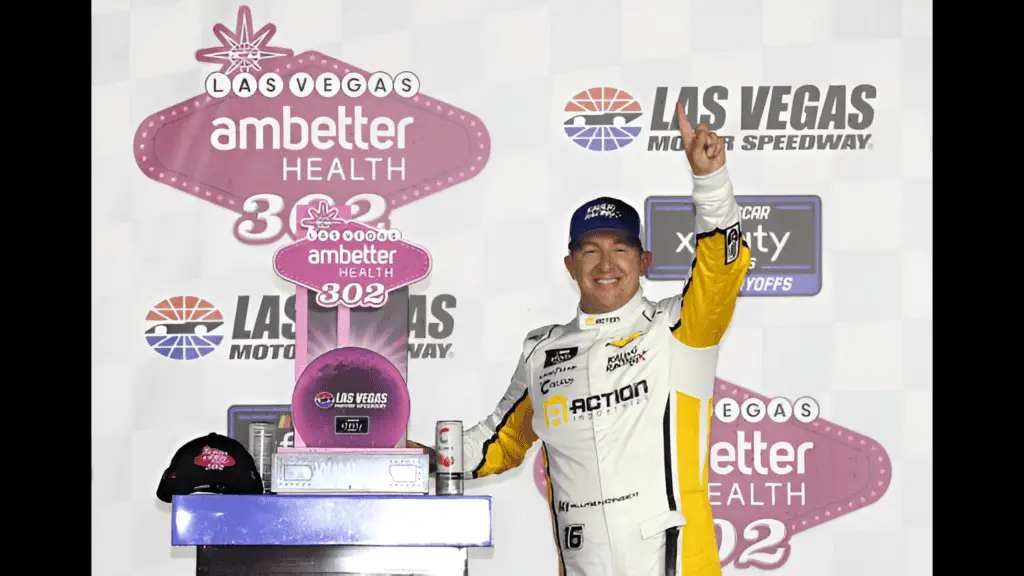 NASCAR Xfinity Series driver AJ Allmendinger celebrates in victory lane after winning the Ambetter Health 302