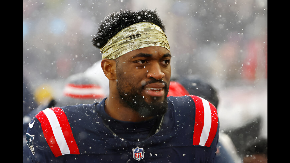 Former New England Patriots pass rusher Josh Uche looks on against the New York Jets