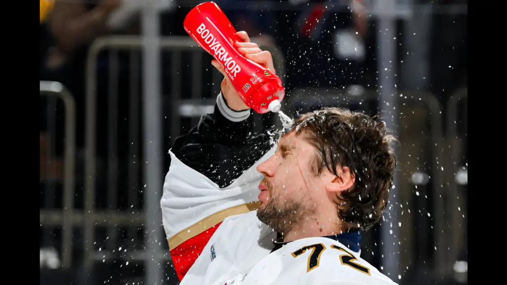 Florida Panthers goalie Sergei Bobrovsky squirts water on his face during a break in the action against the New York Rangers