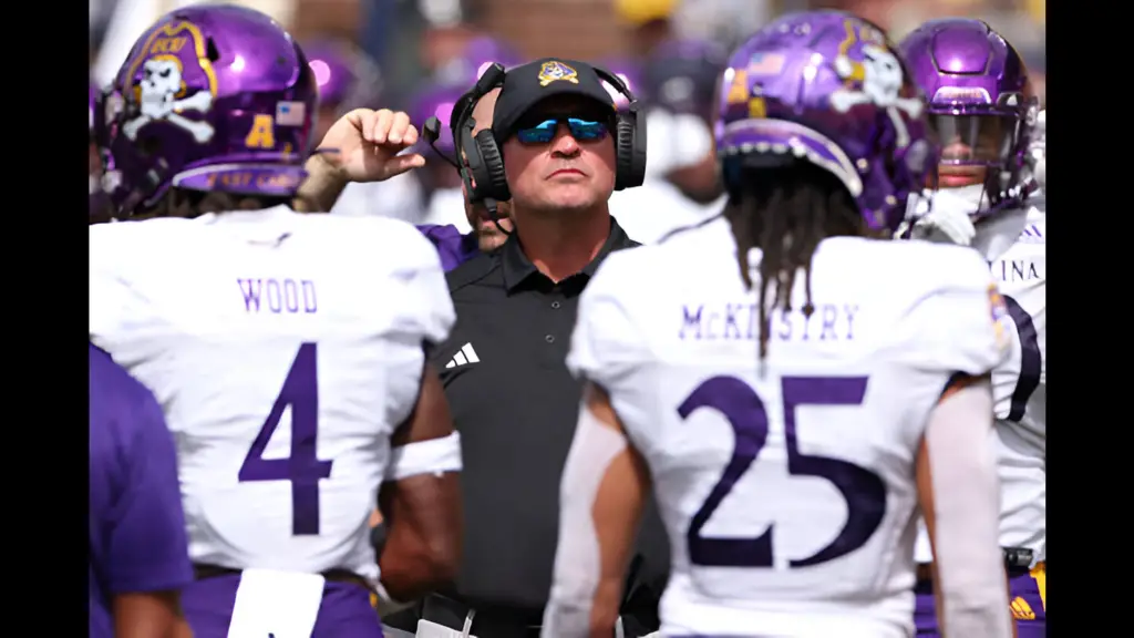 Former East Carolina Pirates head coach Mike Houston looks on in the second half while playing the Michigan Wolverines