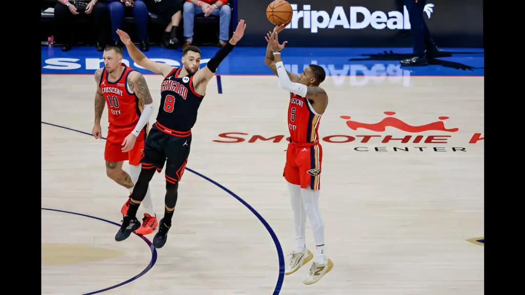 New Orleans Pelicans guard Dejounte Murray shoots over Zach LaVine against the Chicago Bulls during the second half of a game