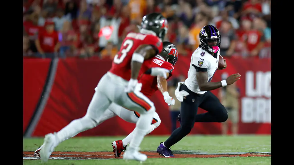 Baltimore Ravens quarterback Lamar Jackson runs with the football during the third quarter against the Tampa Bay Buccaneers