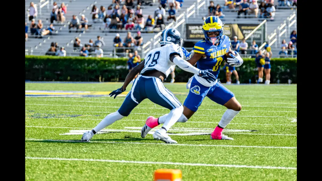 Delaware Blue Hens wide receiver Max Patterson attempts to make a move with the football against the Maine Black Bears