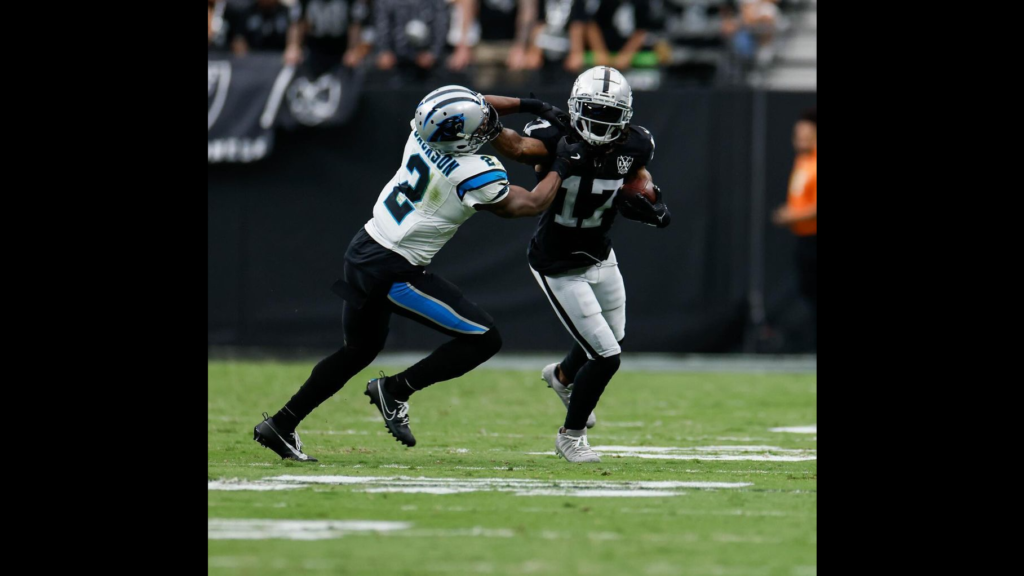 Las Vegas Raiders wide receiver Davante Adams runs with the football against the Carolina Panthers