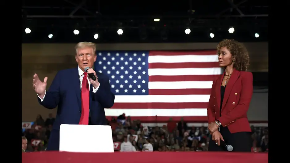 Moderator Sage Steele speaks alongside former U.S. President Donald Trump during a town hall campaign event at the Lancaster County Convention Center