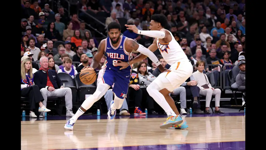 Philadelphia 76ers star Paul George drives against Ryan Dunn against the Phoenix Suns during the game