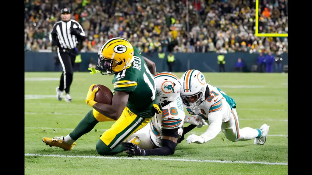 Green Bay Packers wide receiver Jayden Reed catches a pass for a touchdown against the Miami Dolphins during the second quarter of the game