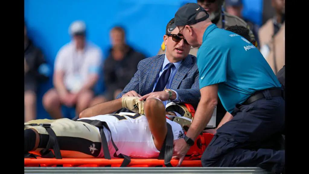 New Orleans Saints wide receiver Chris Olave leaves the field after an injury during the first quarter against the Carolina Panthers