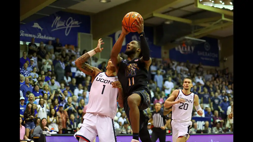 Memphis Tigers player Tyrese Hunter makes a move to the basket during the second half of the Maui Invitational against the Connecticut Huskies