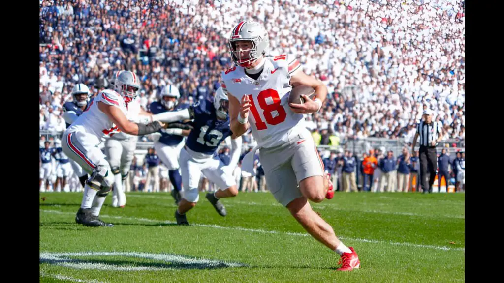 Ohio State Buckeyes Quarterback Will Howard runs with the ball against the Penn State Nittany Lions