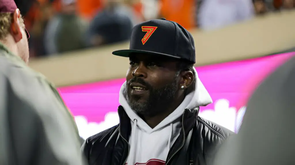 Former NFL player Michael Vick looks on prior to a game between the Virginia Tech Hokies and the Boston College Eagles