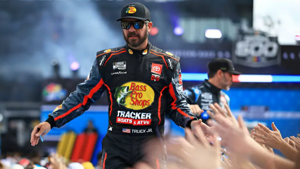 Former NASCAR full-time driver Martin Truex Jr. greets fans as he walks on stage during driver intros prior to the NASCAR Cup Series Daytona 500