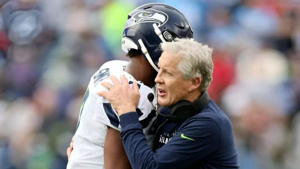 Former Seattle Seahawks head coach Pete Carroll celebrates with Geno Smith after Smith threw the game-winning touchdown pass against the Tennessee Titans