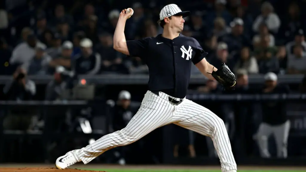 New York Yankees pitcher Gerrit Cole throws a pitch during a spring training game