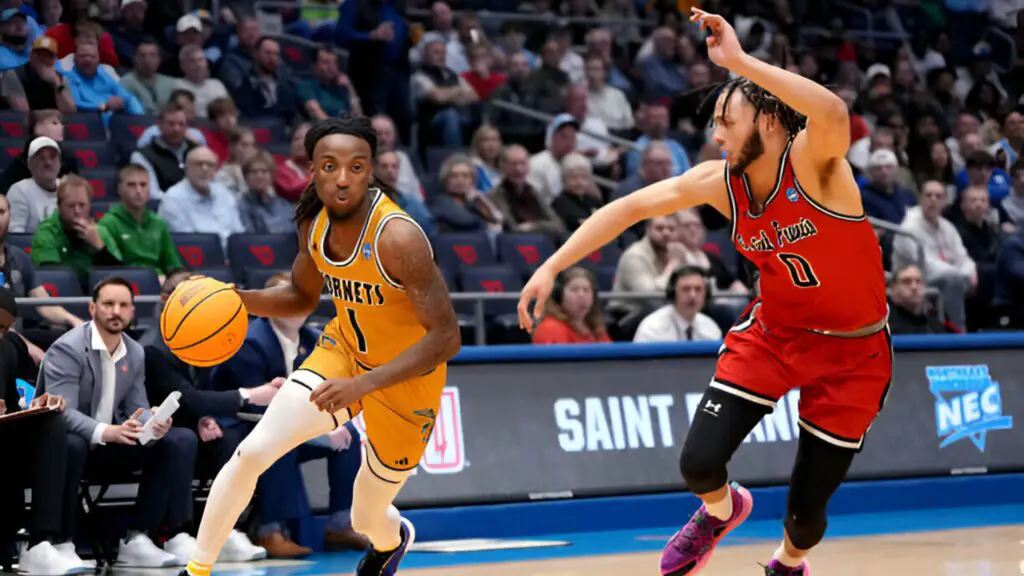 Alabama State Hornets player Amarr Knox dribbles the ball against Chris Moncrief against the St. Francis (Pa) Red Flash during the first half in the First Four game of the NCAA Men's Basketball Tournament