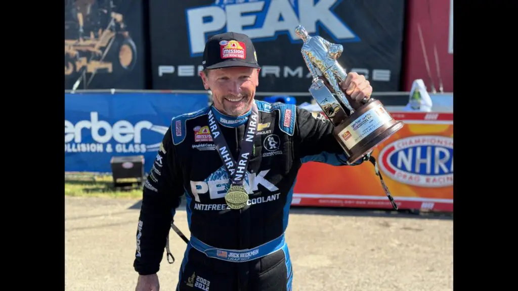 PEAK sponsored Funny Car driver Jack Beckman celebrates after winning the Route 66 Nationals on Sunday at Route 66 Raceway