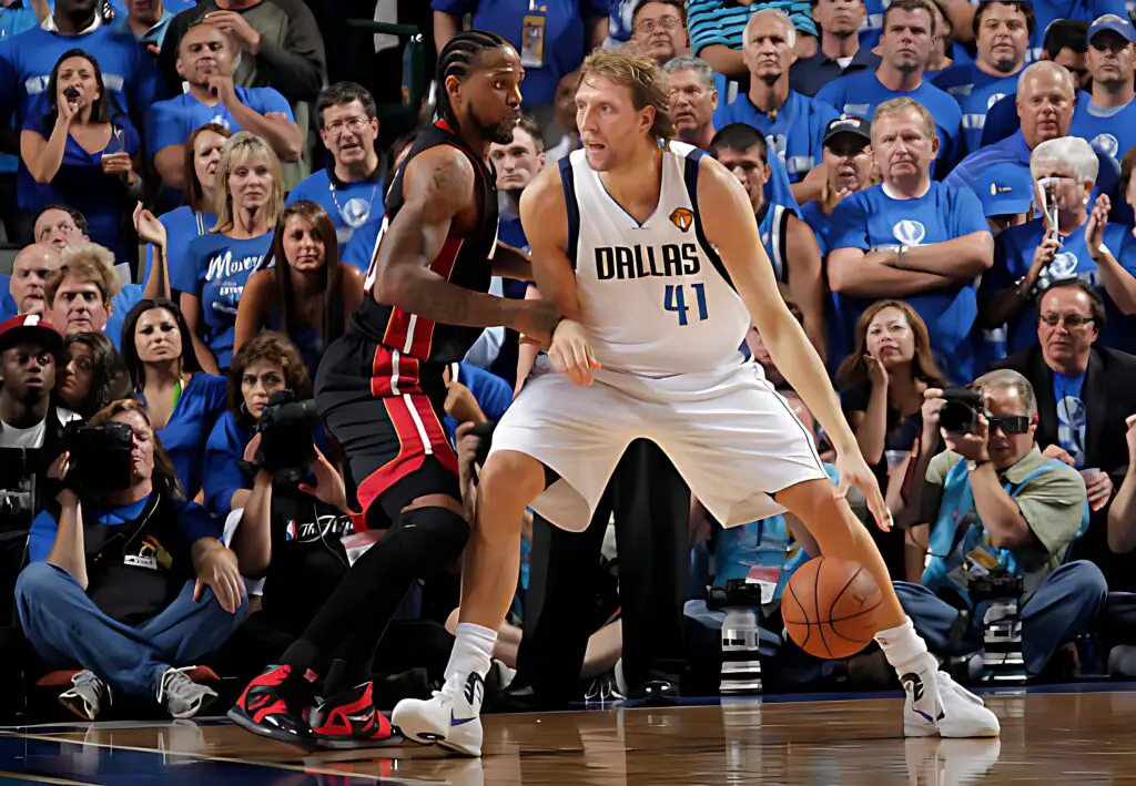 Former Dallas Mavericks star Dirk Nowitzki posts up against Udonis Haslem against the Miami Heat in Game Five of the 2011 NBA Finals